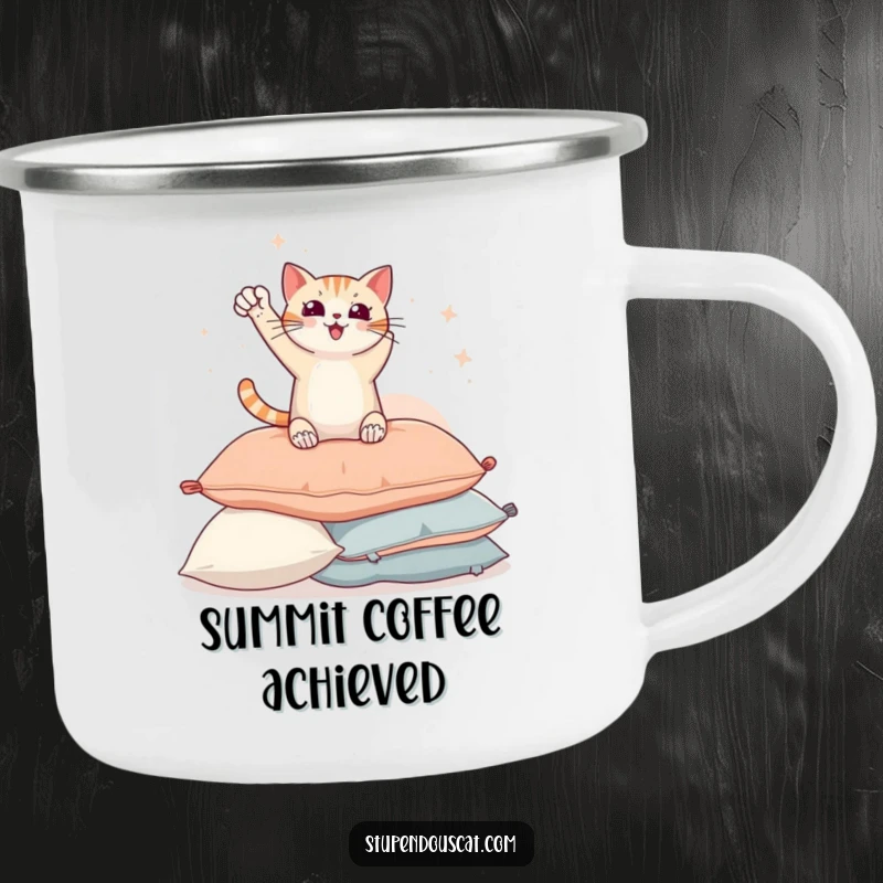 Funny camping mug with a triumphant cat striking a heroic pose on a pile of pillows, ready for outdoor enjoyment.
