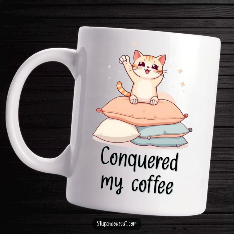 Funny mug with a triumphant cat striking a heroic pose atop a fluffy pile of pillows, exuding pride and victory.