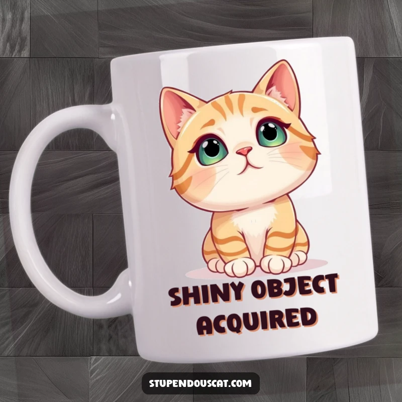Funny cat mug showing a cat with wide eyes and an amazed expression gazing intently at a sparkling, shimmering object.