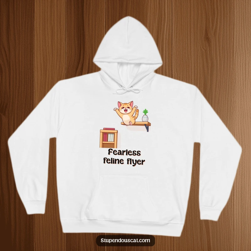 Funny cat hoodie depicting a cat performing an epic, flair-filled leap from a high shelf, radiating playful energy.