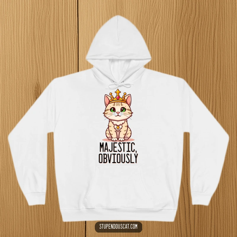 Funny hoodie depicting a regal cat wearing a golden crown, confidently surveying its surroundings like a true monarch.