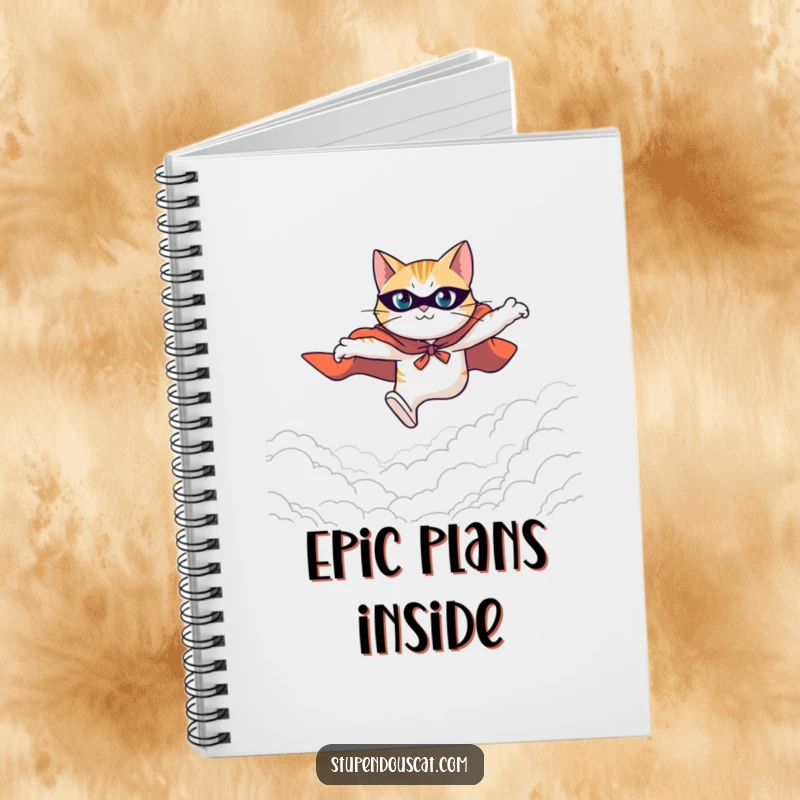 Funny notebook cover featuring a heroic cat in a cape leaping with great determination across a vast and expansive background.