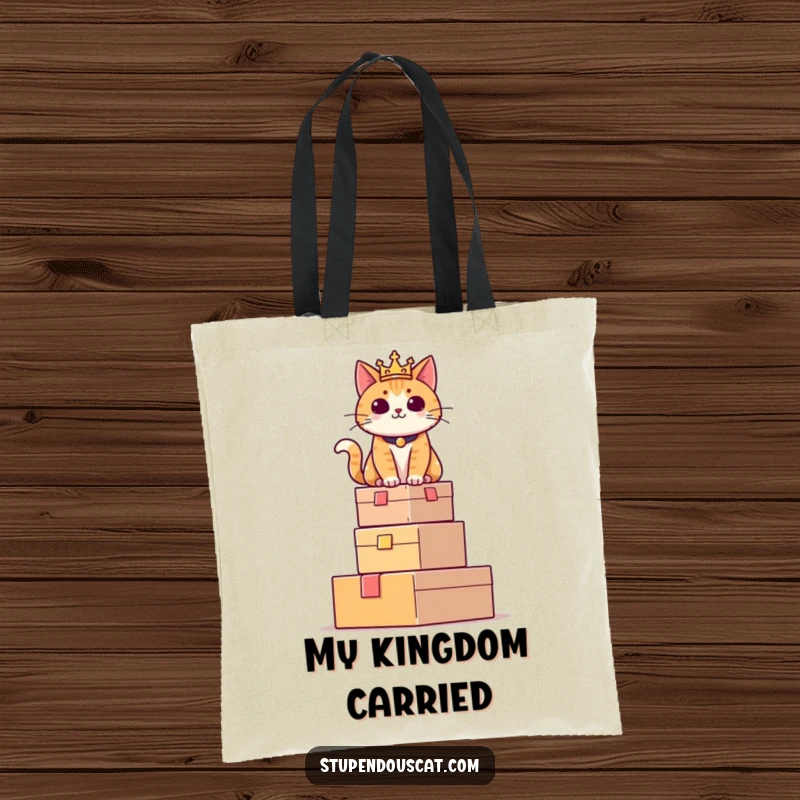 Funny tote bag with a regal cat sitting proudly atop a tower of boxes, perfect for carrying items with feline authority.